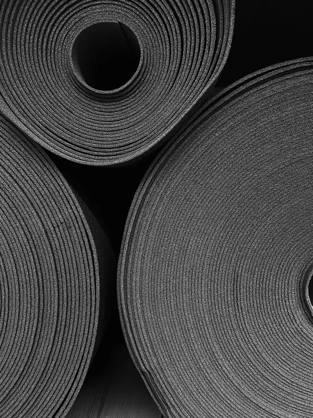 Coiled foam sheet goods stacked on end